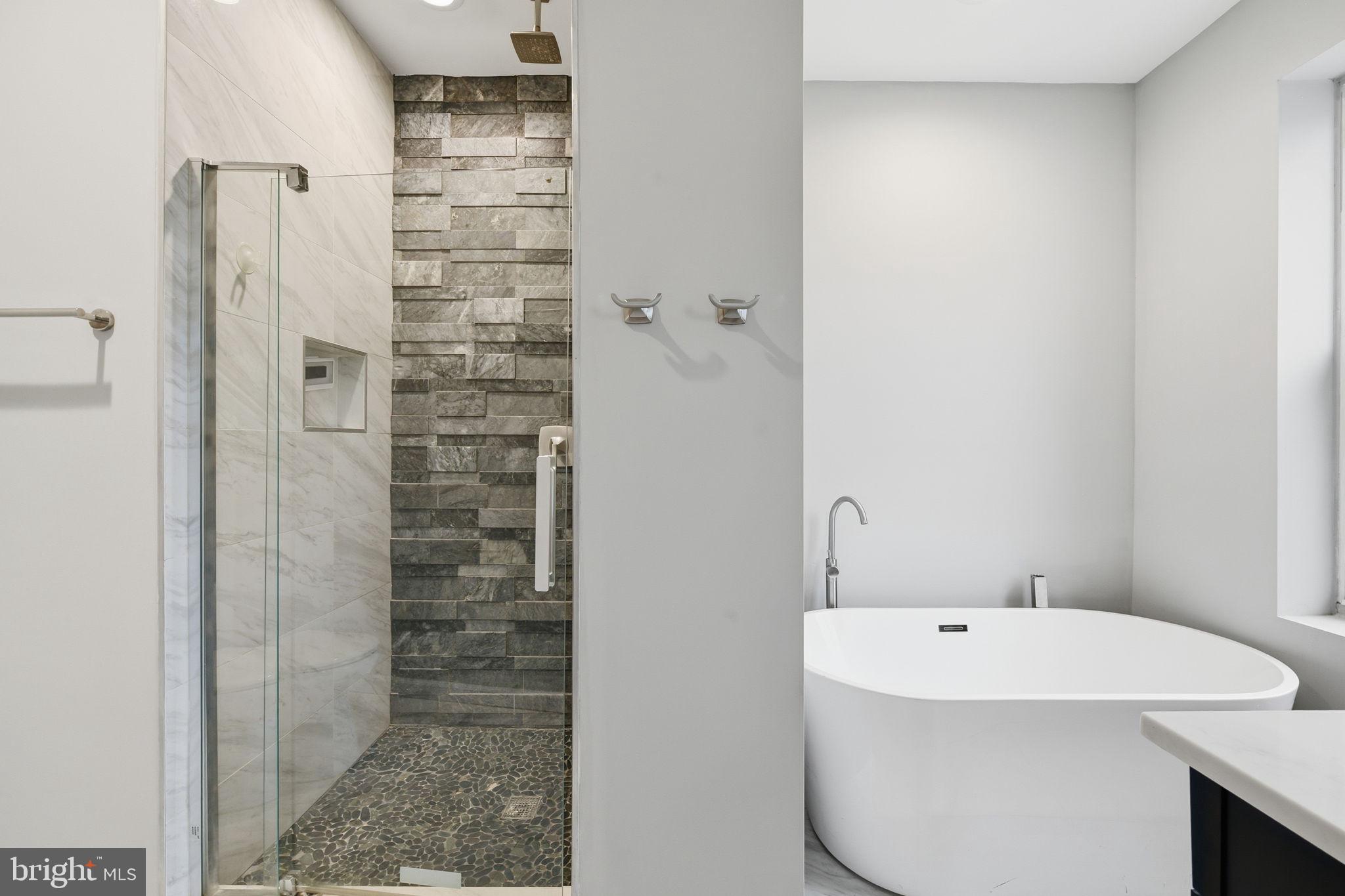 824 Allison Street Northwest Washington, DC 20011 - Photo 16 of 26 a bathroom with a bathtub and shower