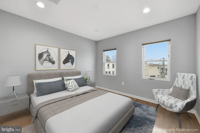 a bedroom with a large bed and a couch