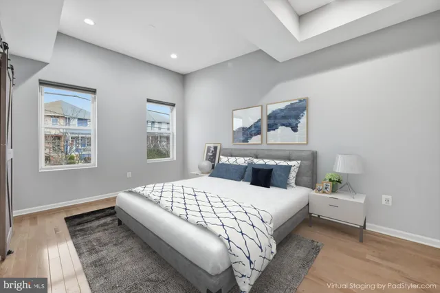 a bedroom with a large bed and a couch