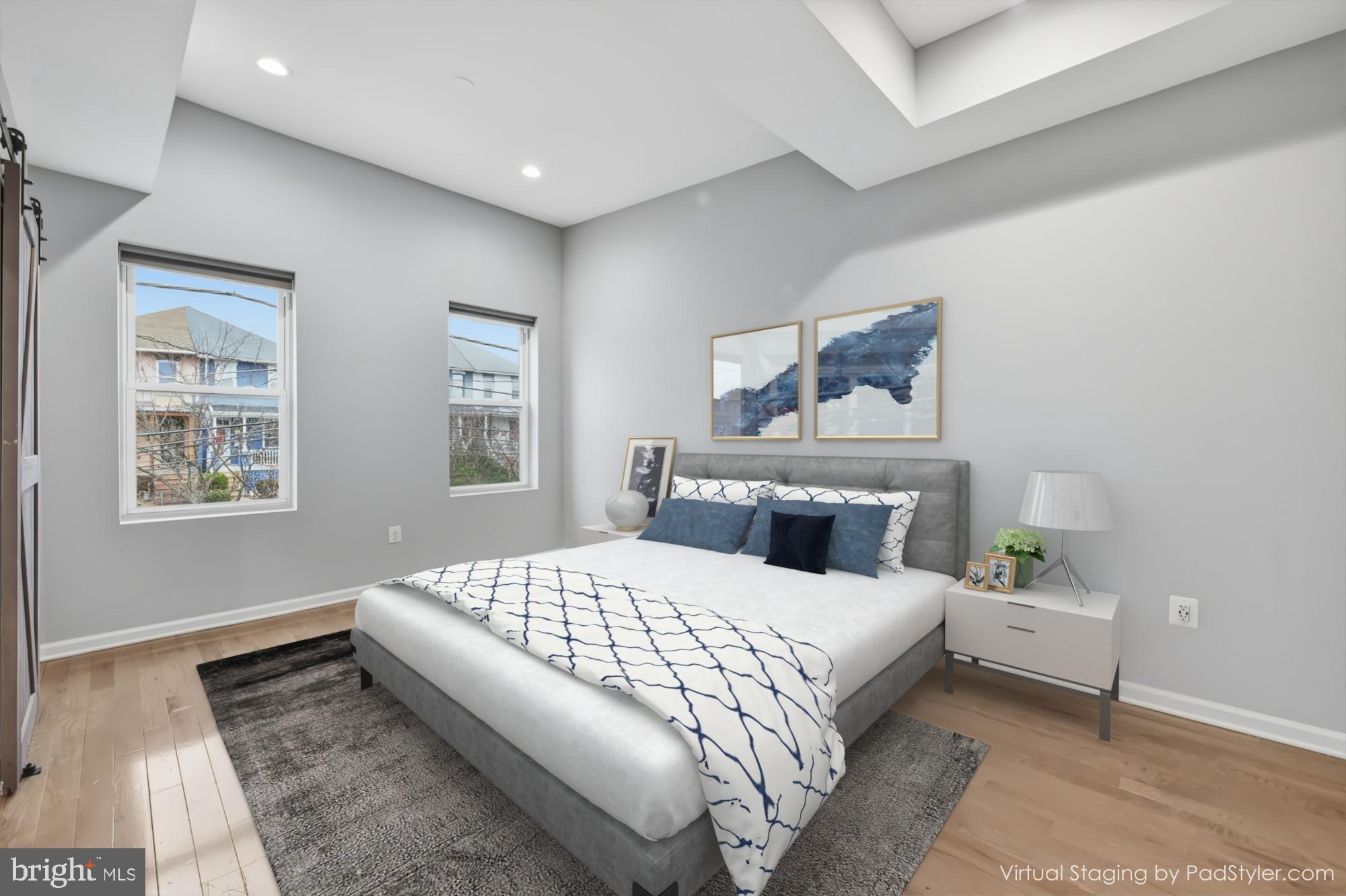 824 Allison Street Northwest Washington, DC 20011 - Photo 9 of 26 a bedroom with a large bed and a couch