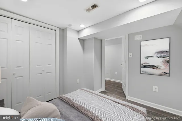 a bedroom with a bed and hallway