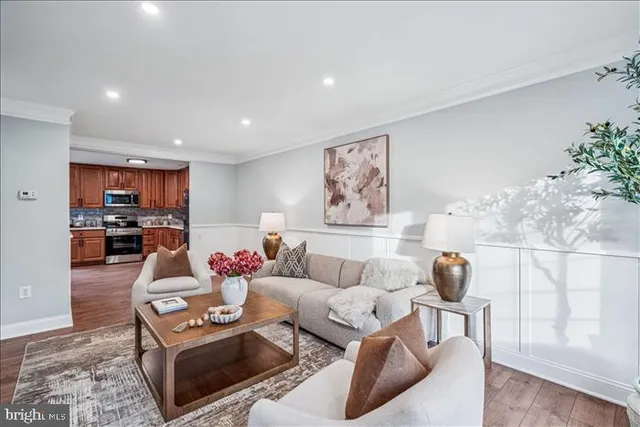 a living room with furniture and flowers