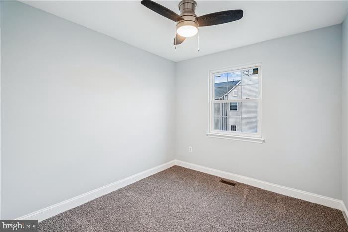 7646 South Arbory Lane, Unit 320 Laurel, MD 20707 - Photo 24 of 45 an empty room with a window and ceiling fan