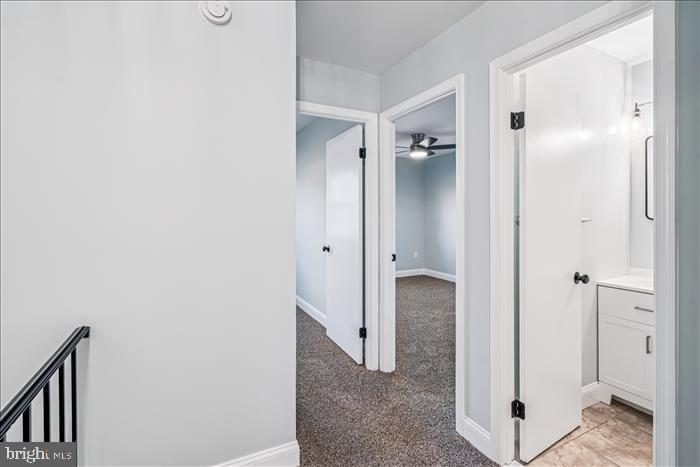 7646 South Arbory Lane, Unit 320 Laurel, MD 20707 - Photo 26 of 45 a view of a bathroom with a shower and a sink