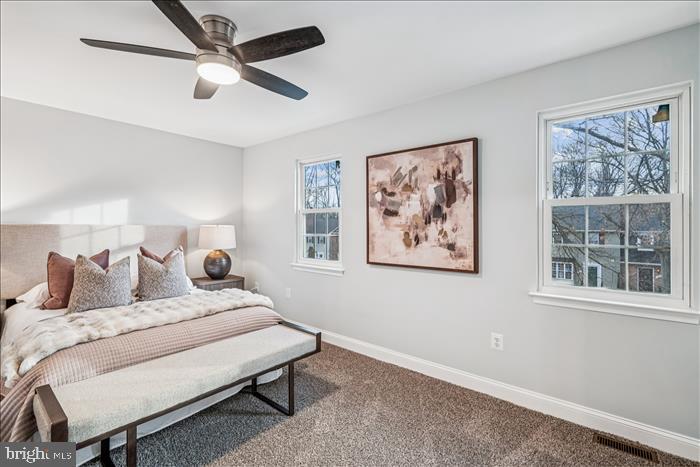 7646 South Arbory Lane, Unit 320 Laurel, MD 20707 - Photo 27 of 45 a bedroom with a bed and a painting on the wall