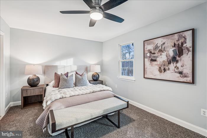 7646 South Arbory Lane, Unit 320 Laurel, MD 20707 - Photo 28 of 45 a bedroom with a bed and lamp