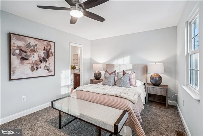 7646 South Arbory Lane, Unit 320 Laurel, MD 20707 - Photo 30 of 45 a bedroom with a bed and wooden floor