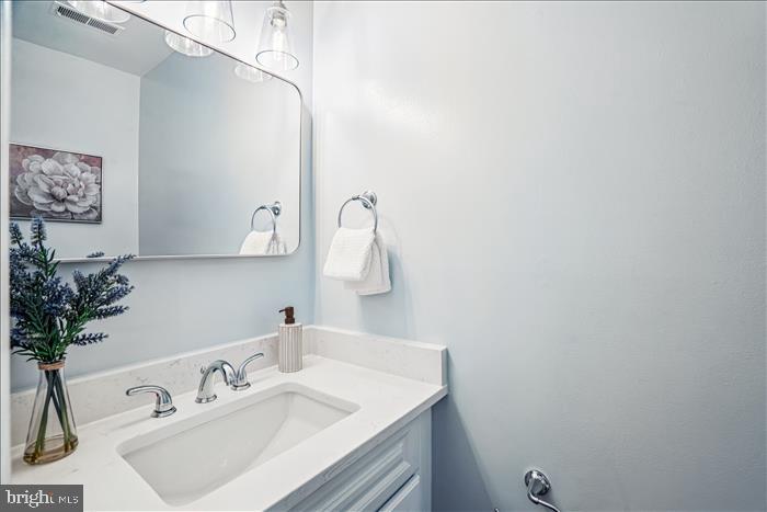 7646 South Arbory Lane, Unit 320 Laurel, MD 20707 - Photo 32 of 45 a bathroom with a sink and a mirror