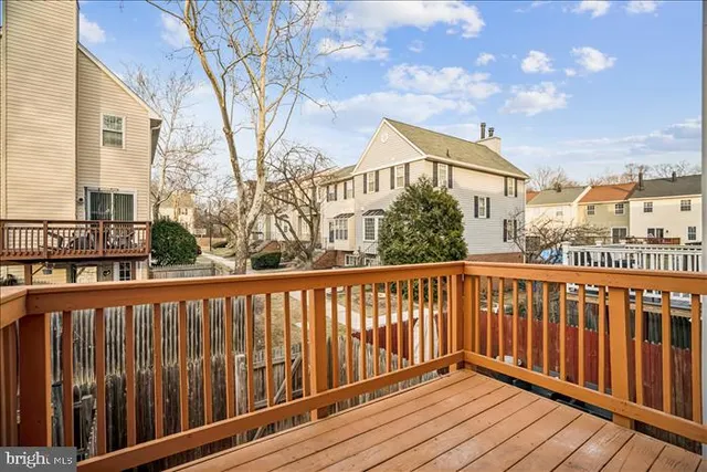 a view of a balcony with wooden floor