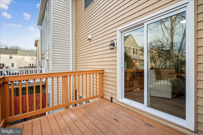 7646 South Arbory Lane, Unit 320 Laurel, MD 20707 - Photo 37 of 45 a view of a balcony with wooden floor