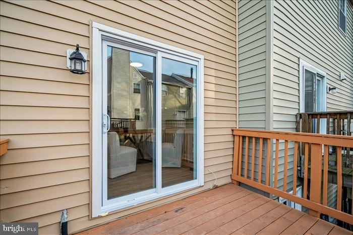 7646 South Arbory Lane, Unit 320 Laurel, MD 20707 - Photo 38 of 45 a view of a balcony with a potted plant