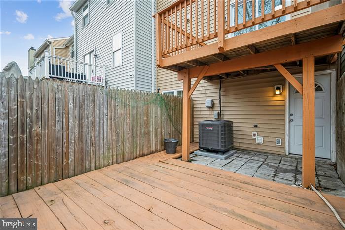 7646 South Arbory Lane, Unit 320 Laurel, MD 20707 - Photo 40 of 45 a view of a backyard with a wooden fence