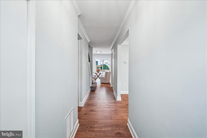 7646 South Arbory Lane, Unit 320 Laurel, MD 20707 - Photo 5 of 45 a view of a hallway with wooden floor