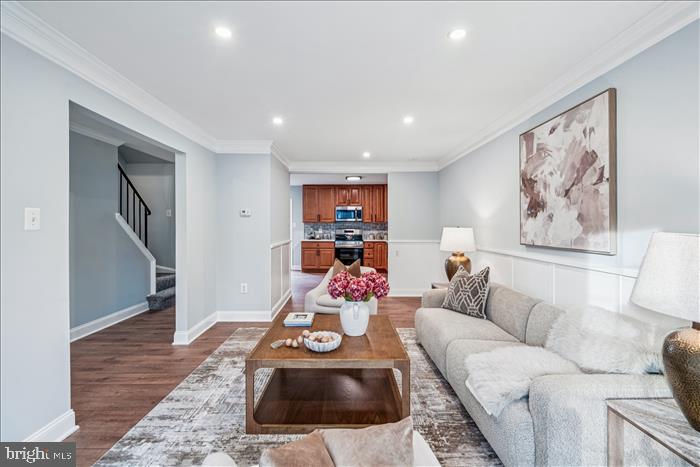 7646 South Arbory Lane, Unit 320 Laurel, MD 20707 - Photo 6 of 45 a living room with furniture and wooden floor