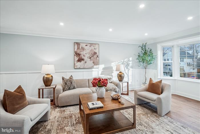 7646 South Arbory Lane, Unit 320 Laurel, MD 20707 - Photo 7 of 45 a living room with furniture and wooden floor