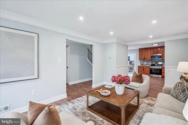 a living room with furniture and flowers
