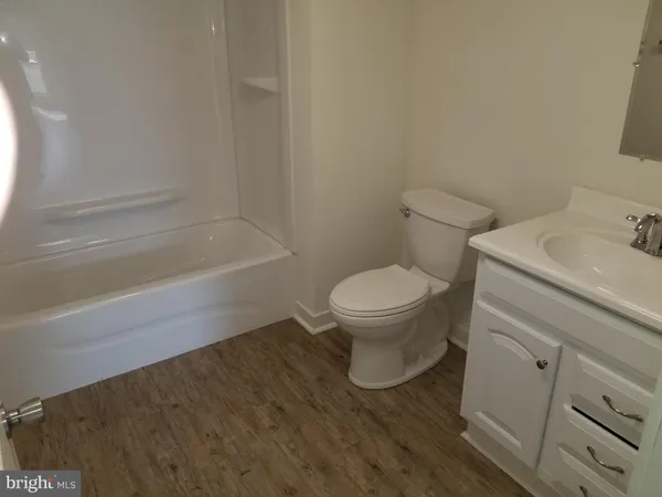 a bathroom with a sink toilet and bathtub