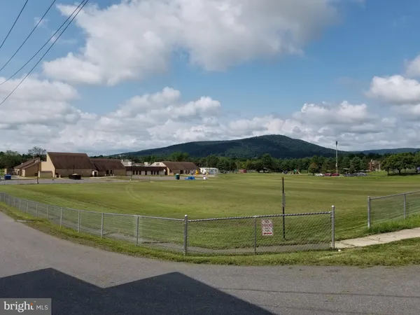 a view of a golf course with a lake