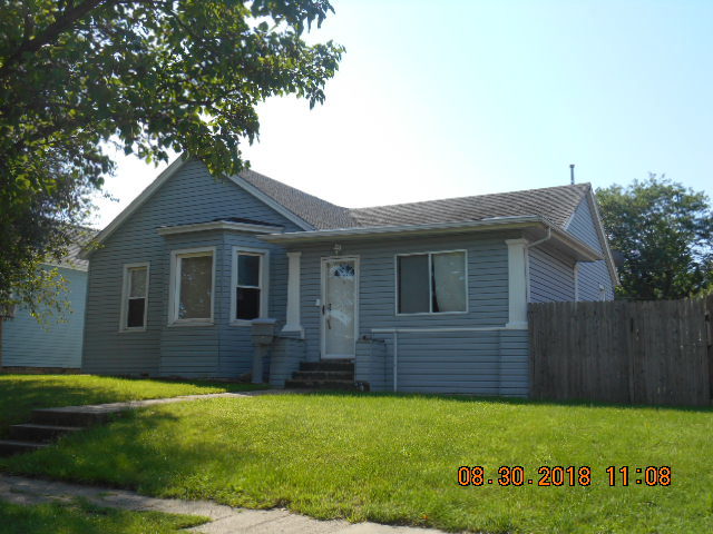 a brick house with a yard