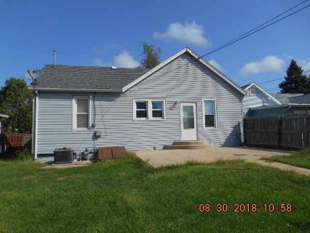 109 West Cleveland Street Spring Valley, IL 61362 - Photo 11 of 11 a view of a house with a yard potted plants and a bench