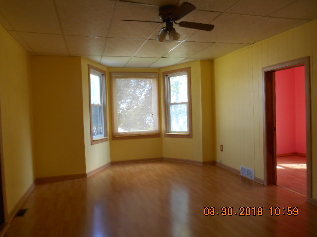 109 West Cleveland Street Spring Valley, IL 61362 - Photo 3 of 11 an empty room with windows