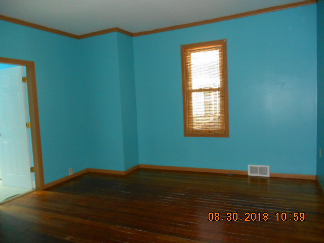 109 West Cleveland Street Spring Valley, IL 61362 - Photo 4 of 11 a view of empty room with window and entryway
