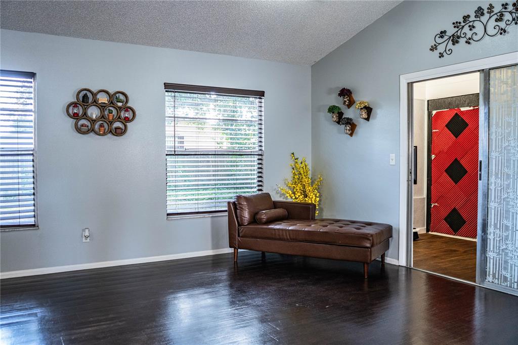 3304 Fox Ridge Drive Winter Haven, FL 33884 - Photo 15 of 60 a living room with furniture and paintings on the wall