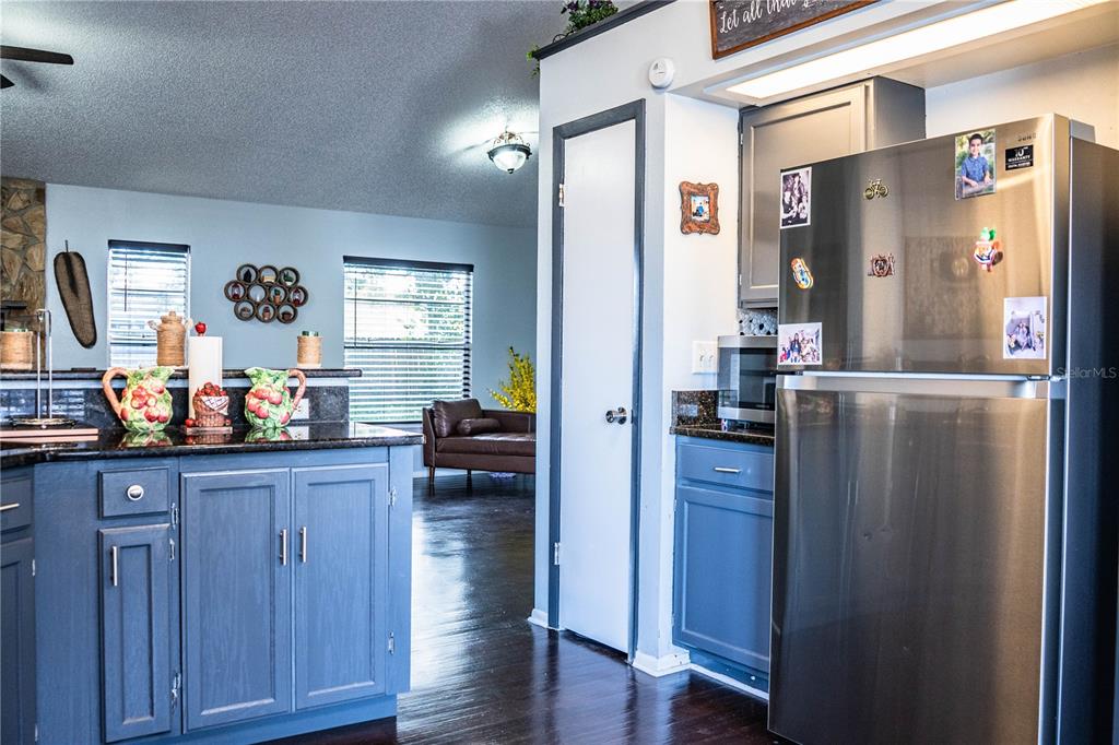 3304 Fox Ridge Drive Winter Haven, FL 33884 - Photo 18 of 60 a kitchen with refrigerator and cabinets
