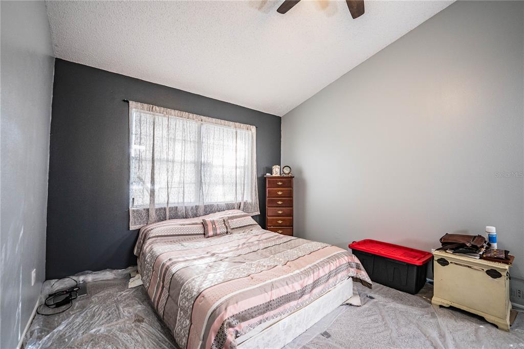 3304 Fox Ridge Drive Winter Haven, FL 33884 - Photo 24 of 60 a bedroom with a bed and window