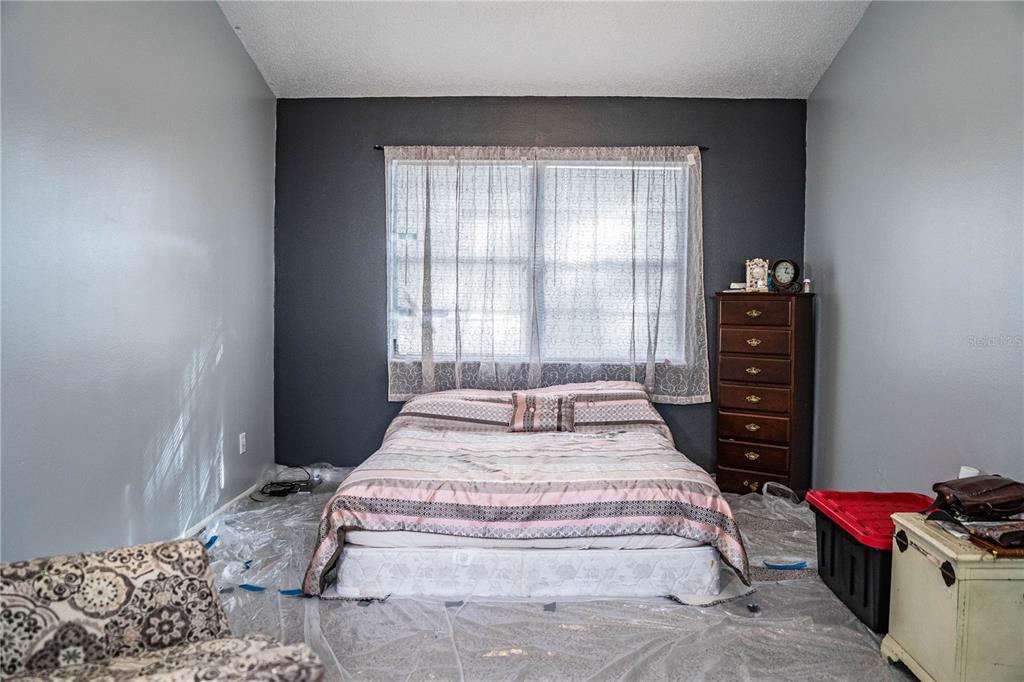 3304 Fox Ridge Drive Winter Haven, FL 33884 - Photo 26 of 60 a bedroom with a bed and a window