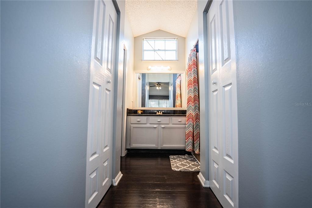3304 Fox Ridge Drive Winter Haven, FL 33884 - Photo 29 of 60 a view of a hallway with wooden floor and a window