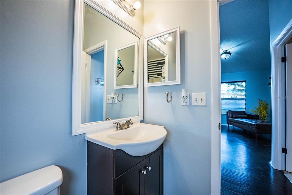 3304 Fox Ridge Drive Winter Haven, FL 33884 - Photo 37 of 60 a bathroom with a sink a toilet and a mirror