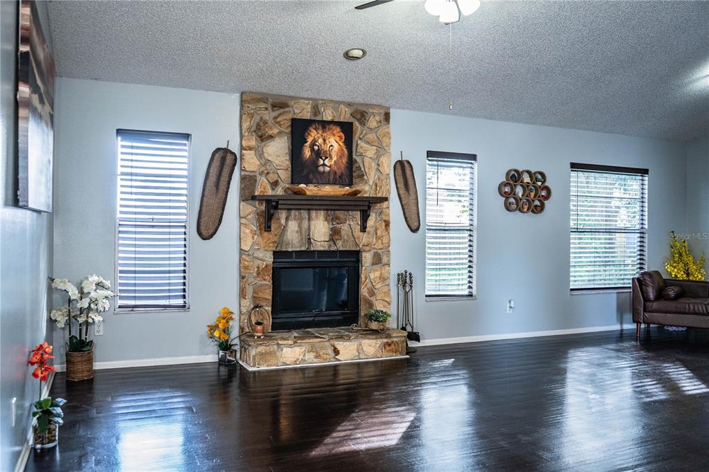 3304 Fox Ridge Drive Winter Haven, FL 33884 - Photo 8 of 60 a living room with furniture fireplace and window