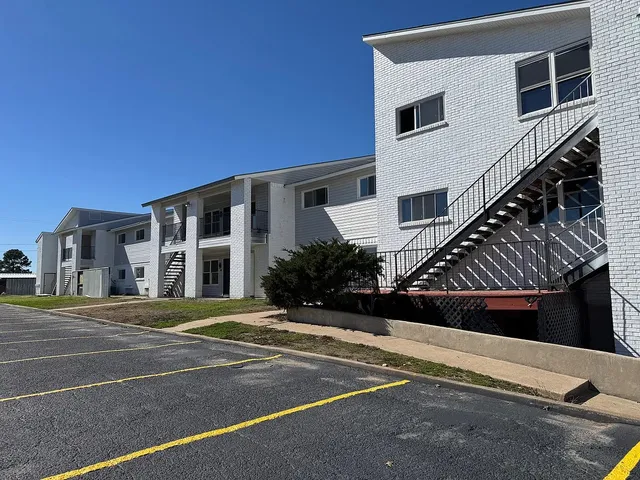a view of a building with a street