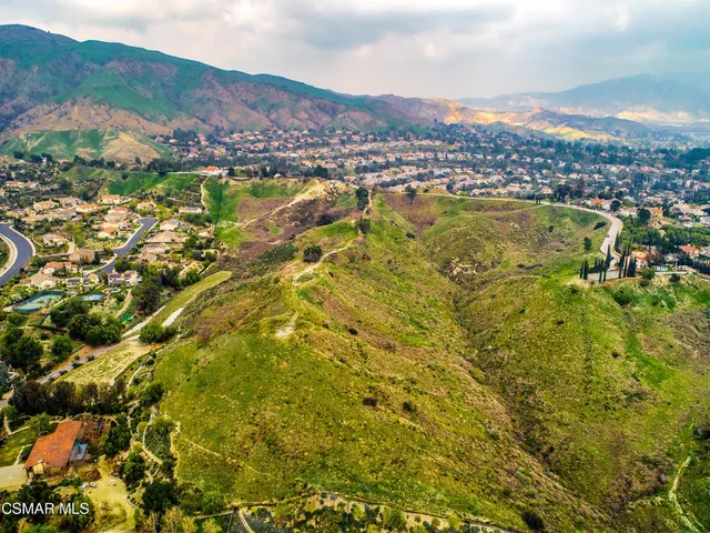 a view of a city with mountains in the background