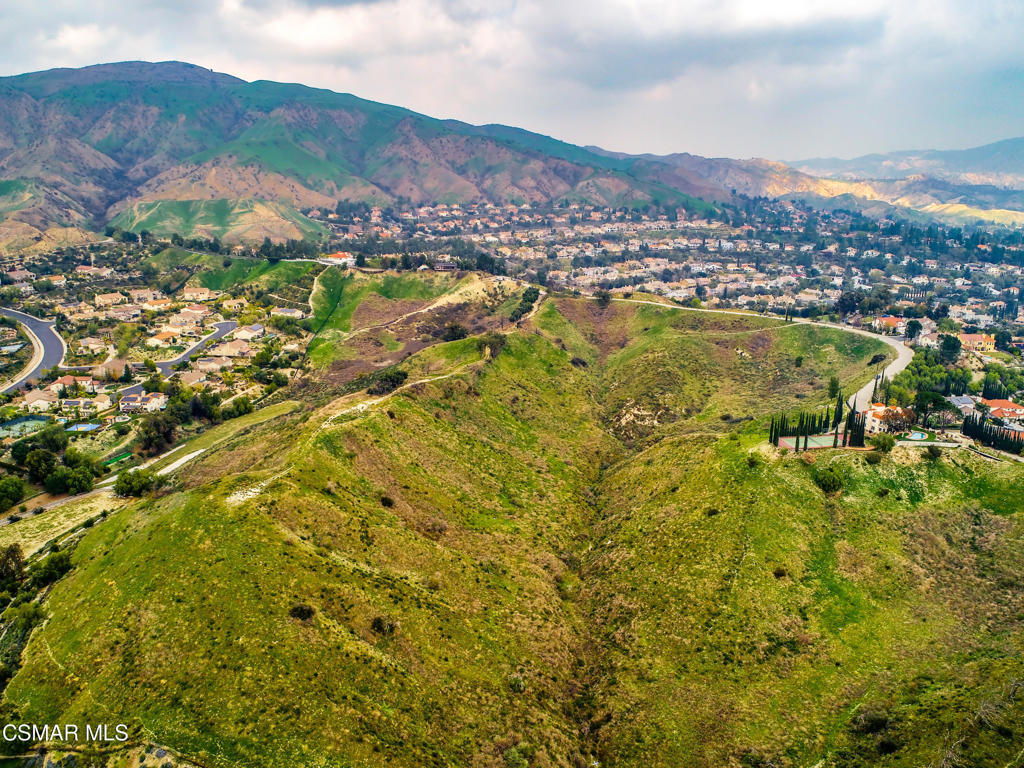 17900 Bull Canyon Road Granada Hills, CA 91344 - Photo 25 of 34 a view of a city with mountains in the background