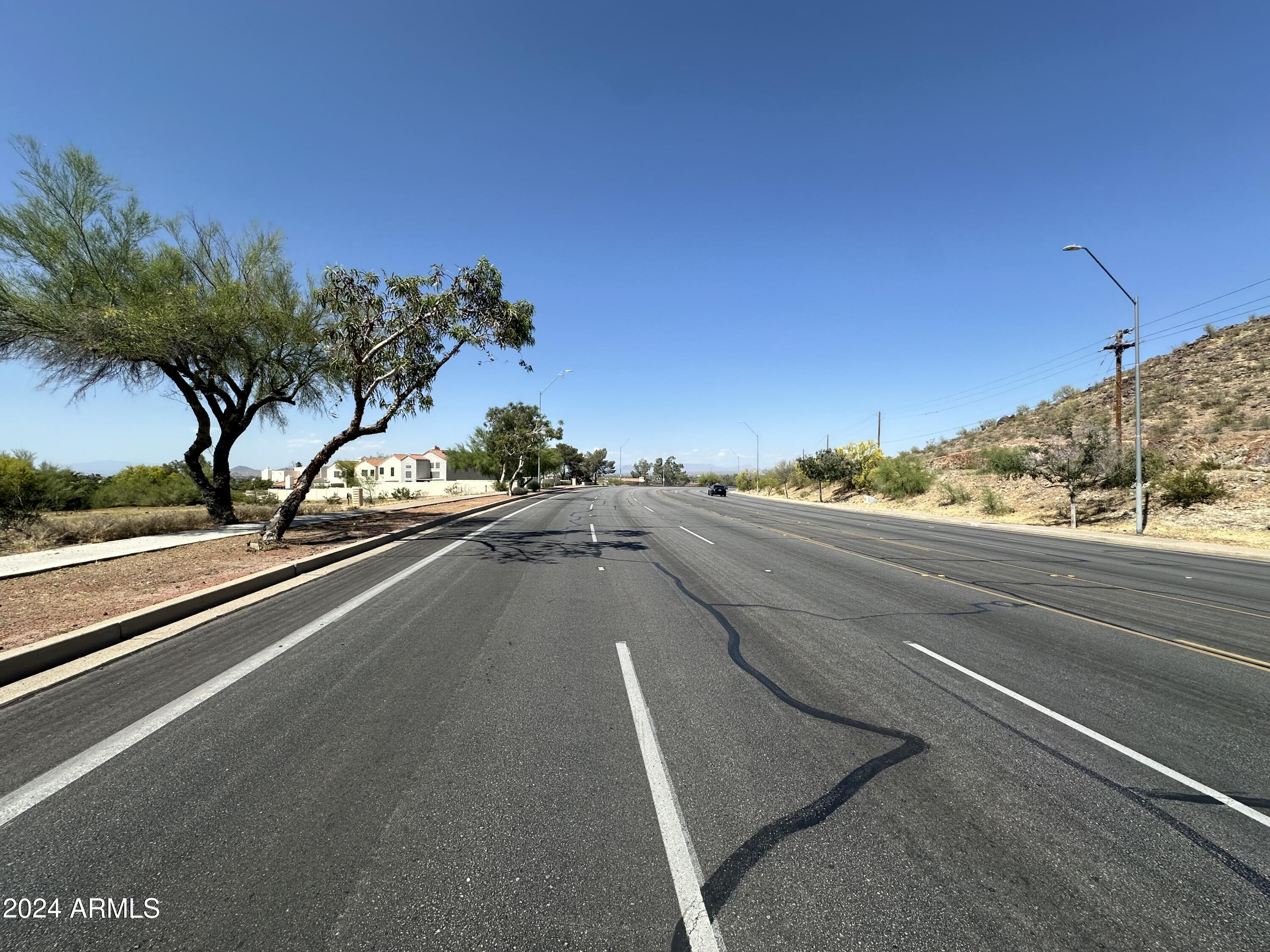 14220 North Cave Creek Road Phoenix, AZ 85022 - Photo 10 of 14 a view of a street with a road