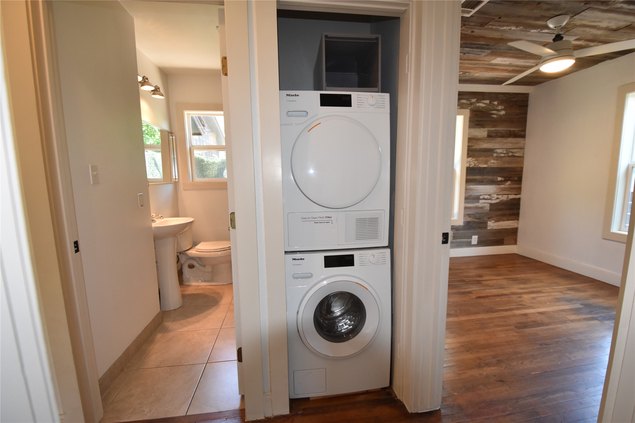 2012 Payne Avenue, Unit A Austin, TX 78757 - Photo 19 of 33 Compact laundry closet featuring stacked Miele washer and dryer units