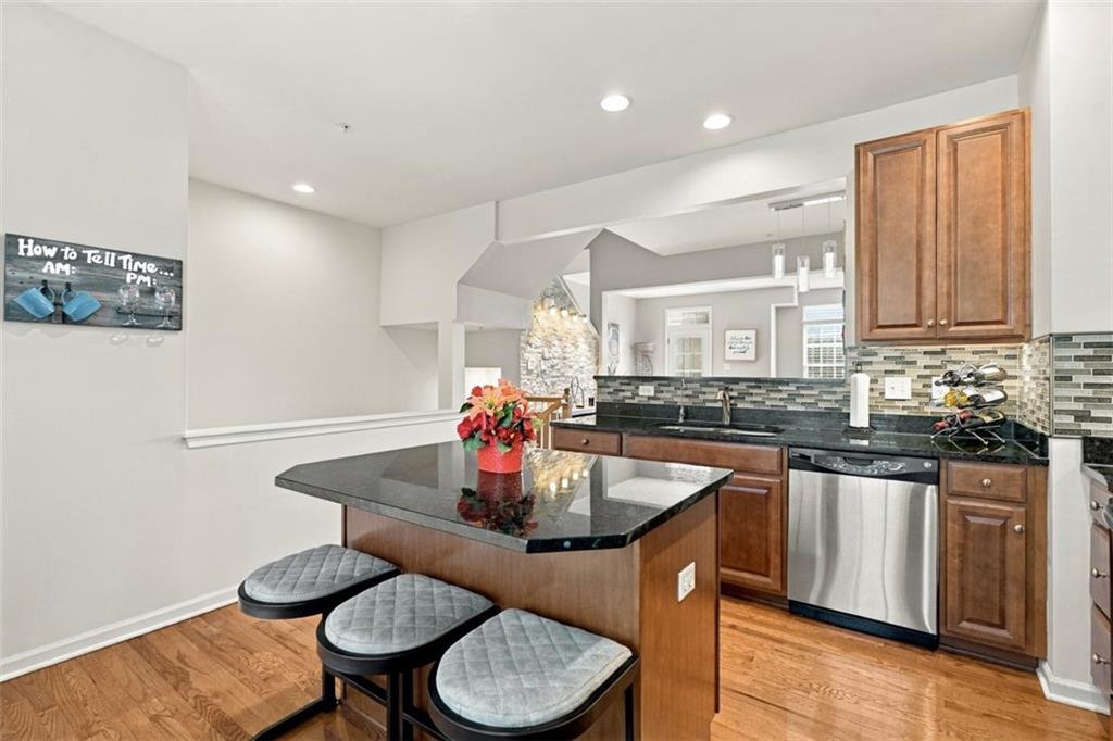141 Lewisham Road Cranberry Township, PA 16066 - Photo 12 of 50 The functional central island comfortably accommodates three counter-height stools, serving as the perfect social hub for casual morning coffee or evening entertaining.