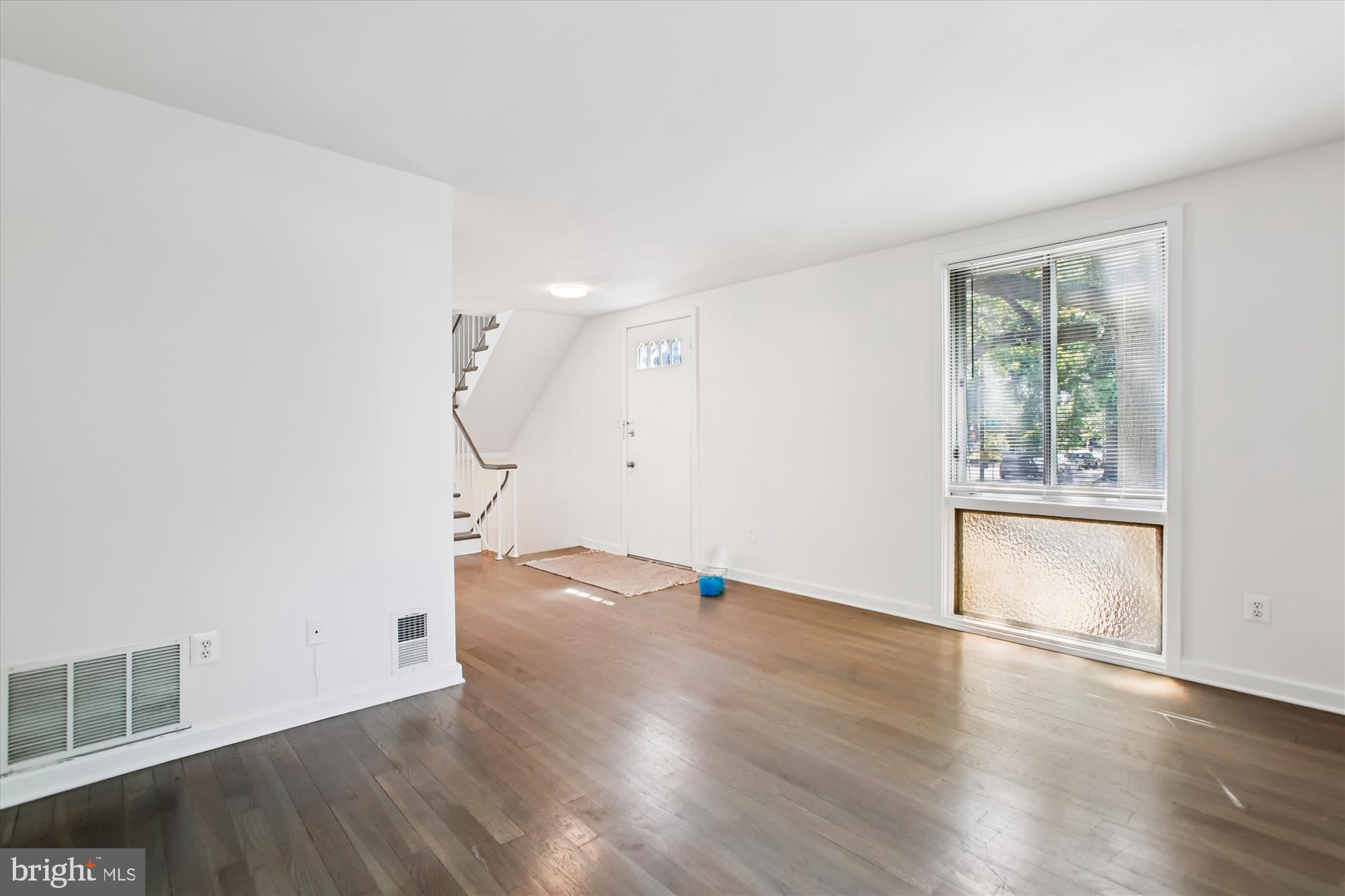 301 I Street Southwest, Unit 108 Washington, DC 20024 - Photo 13 of 55 a view of empty room with wooden floor and fan