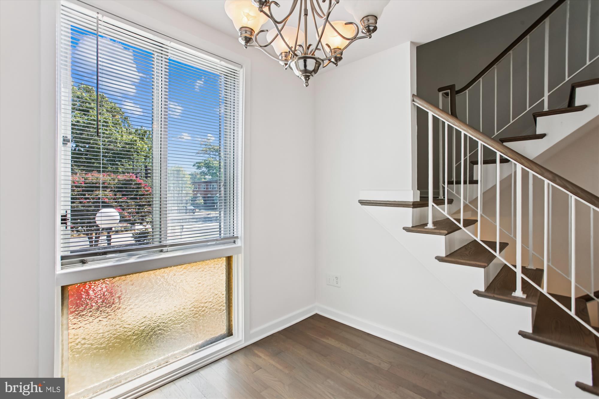301 I Street Southwest, Unit 108 Washington, DC 20024 - Photo 15 of 55 a view of a hallway with wooden floor and staircase