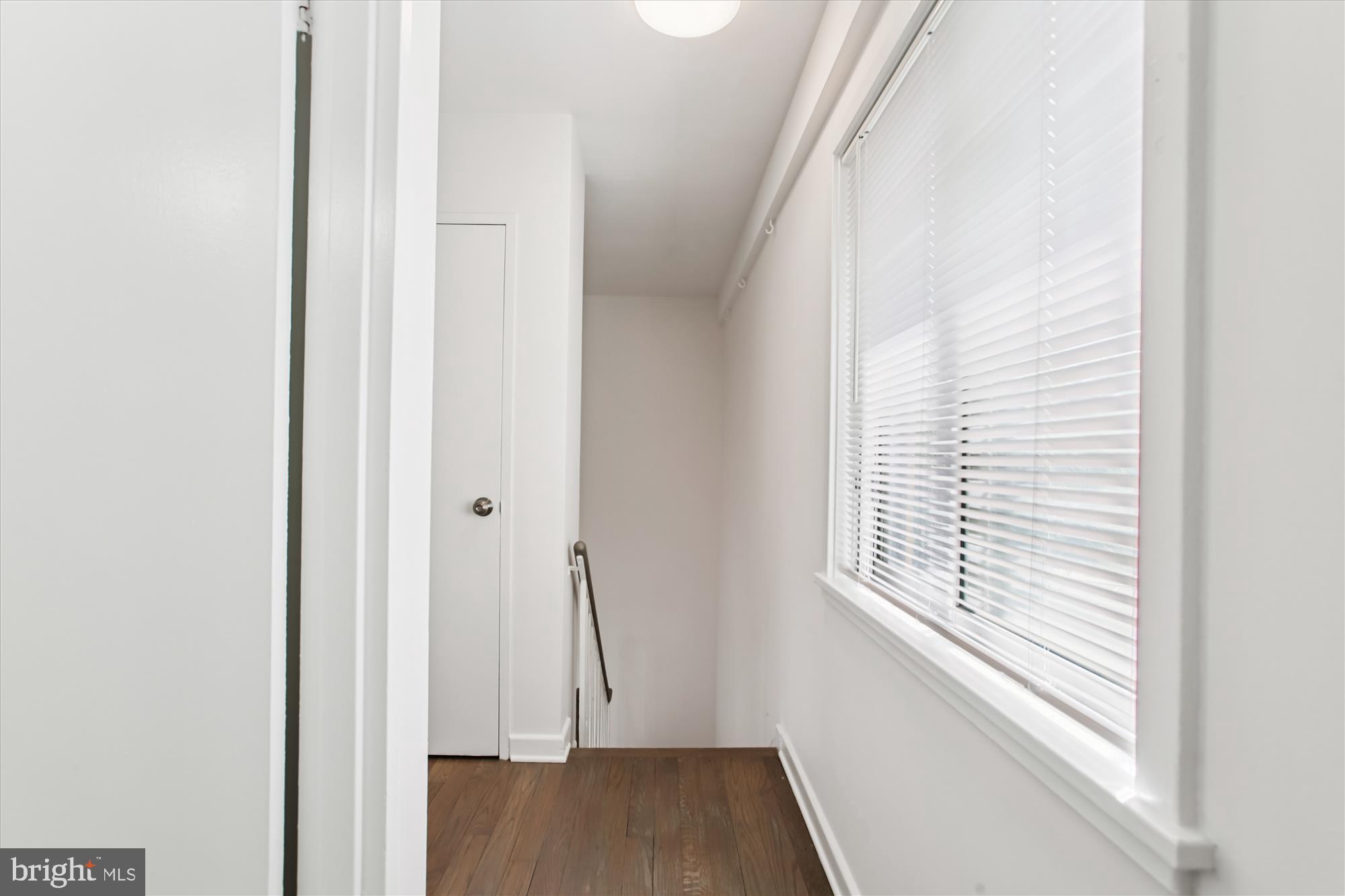 301 I Street Southwest, Unit 108 Washington, DC 20024 - Photo 18 of 55 a view of a room with wooden floor and windows