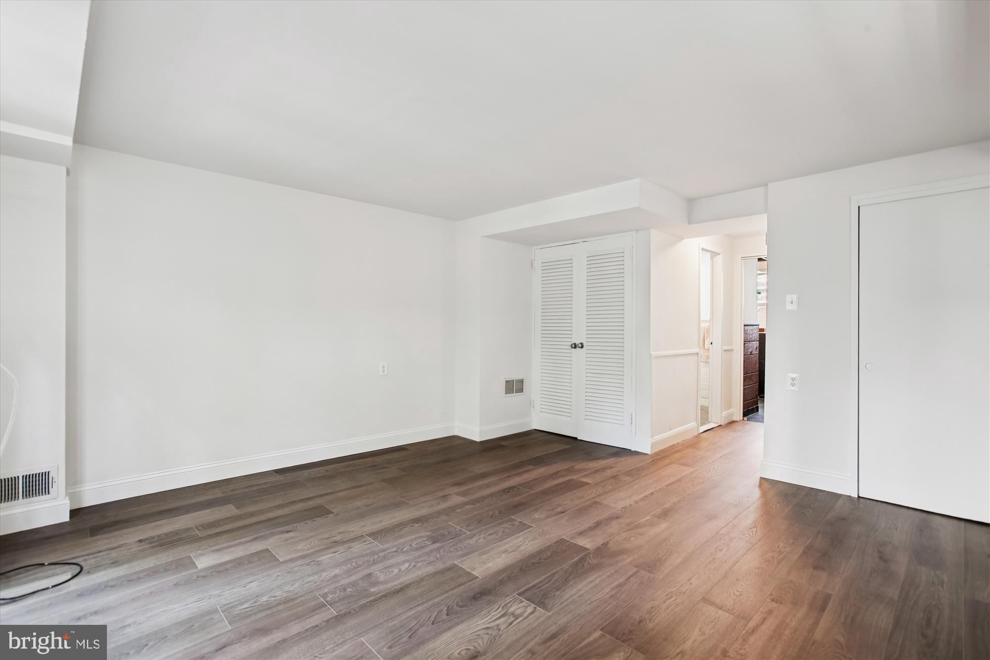 301 I Street Southwest, Unit 108 Washington, DC 20024 - Photo 24 of 55 a view of an empty room with wooden floor