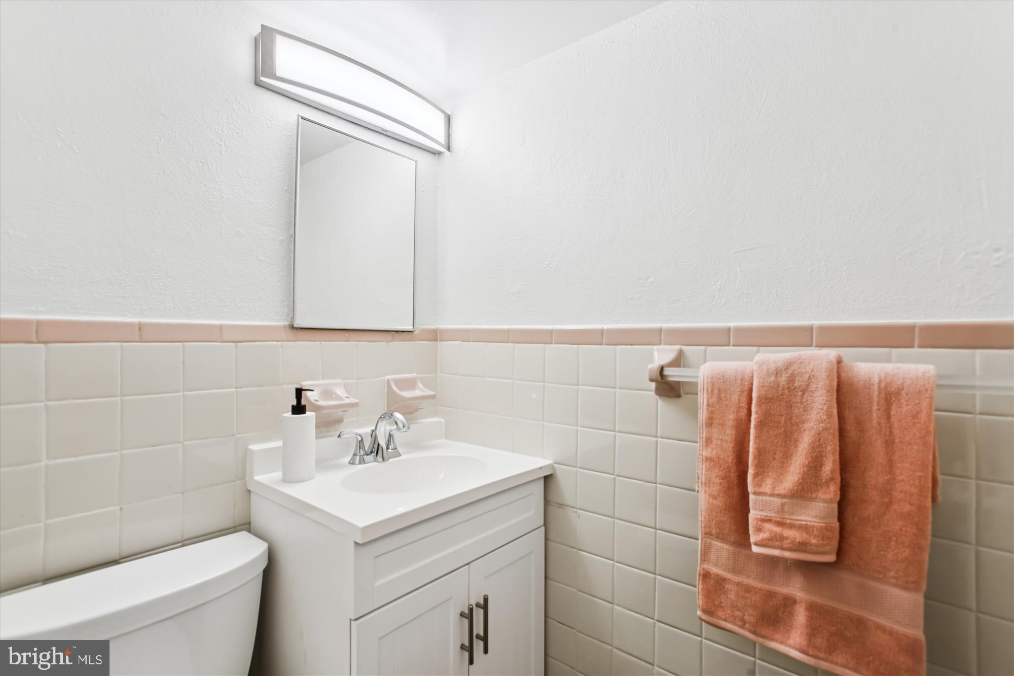 301 I Street Southwest, Unit 108 Washington, DC 20024 - Photo 27 of 55 a bathroom with a sink toilet and vanity
