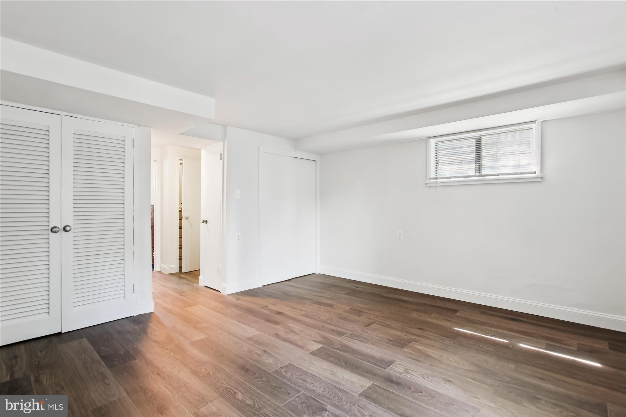 301 I Street Southwest, Unit 108 Washington, DC 20024 - Photo 28 of 55 a view of an empty room with wooden floor