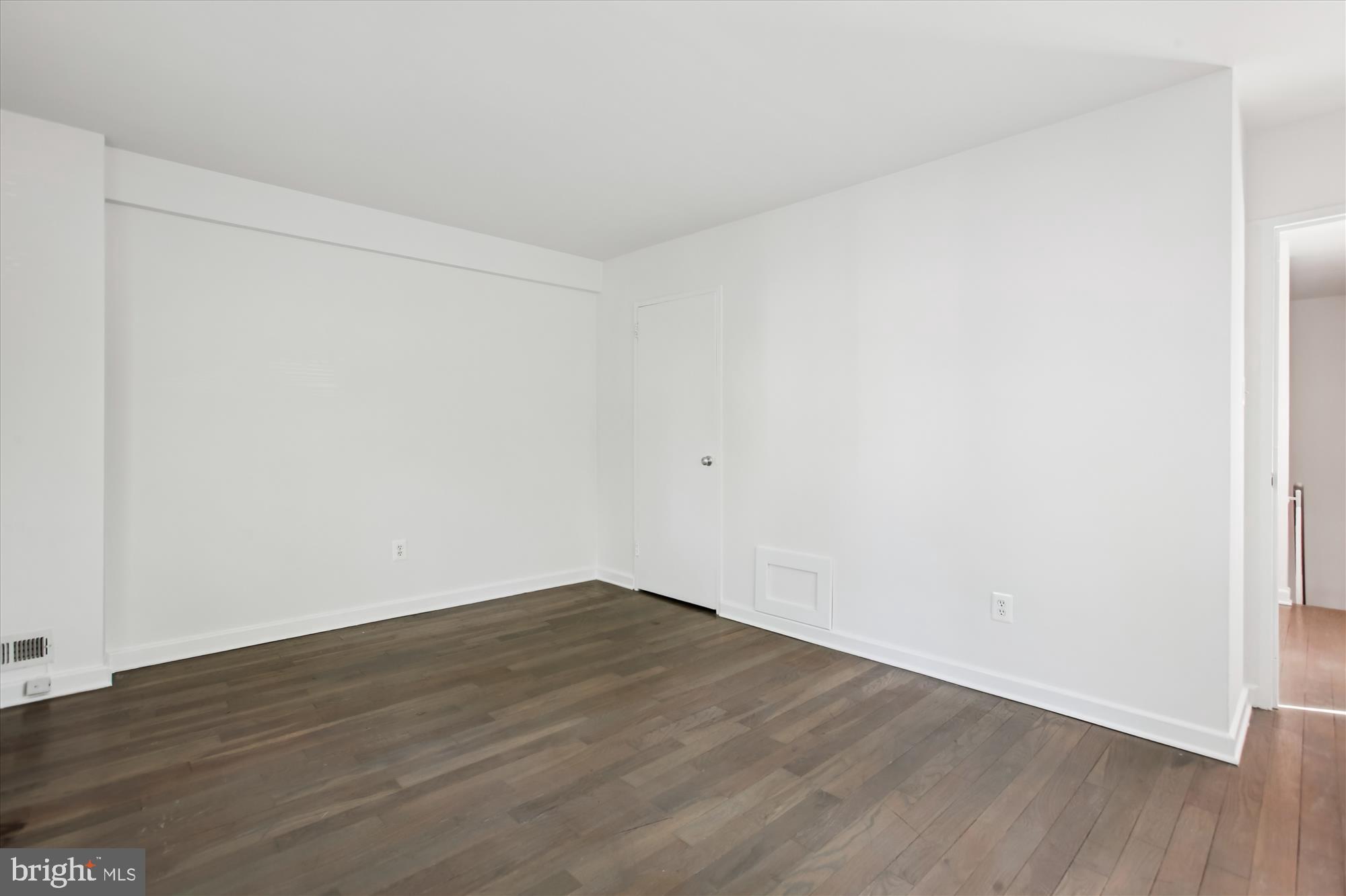 301 I Street Southwest, Unit 108 Washington, DC 20024 - Photo 30 of 55 a view of an empty room with wooden floor