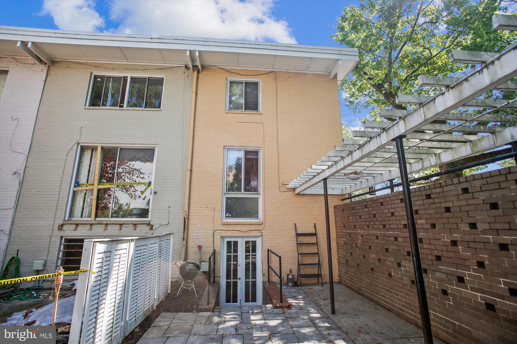 301 I Street Southwest, Unit 108 Washington, DC 20024 - Photo 33 of 55 a view of a house with a small space and wooden deck