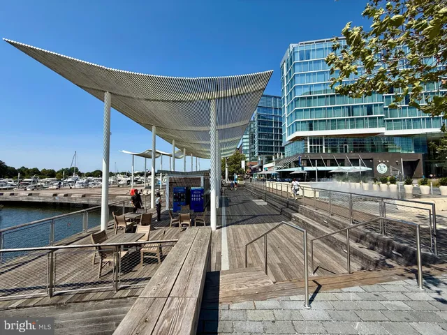 a view of a brick building with a bench in front of building