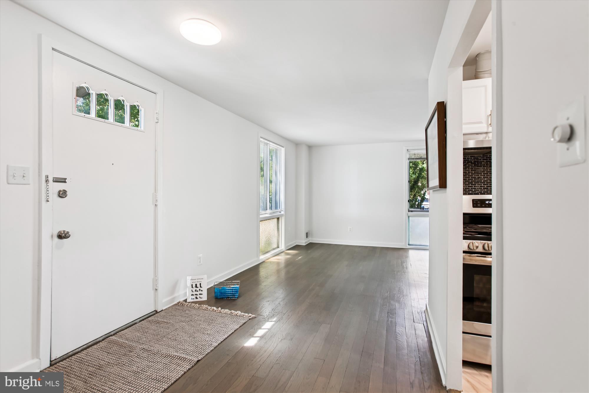 301 I Street Southwest, Unit 108 Washington, DC 20024 - Photo 6 of 55 an empty room with wooden floor closet and windows