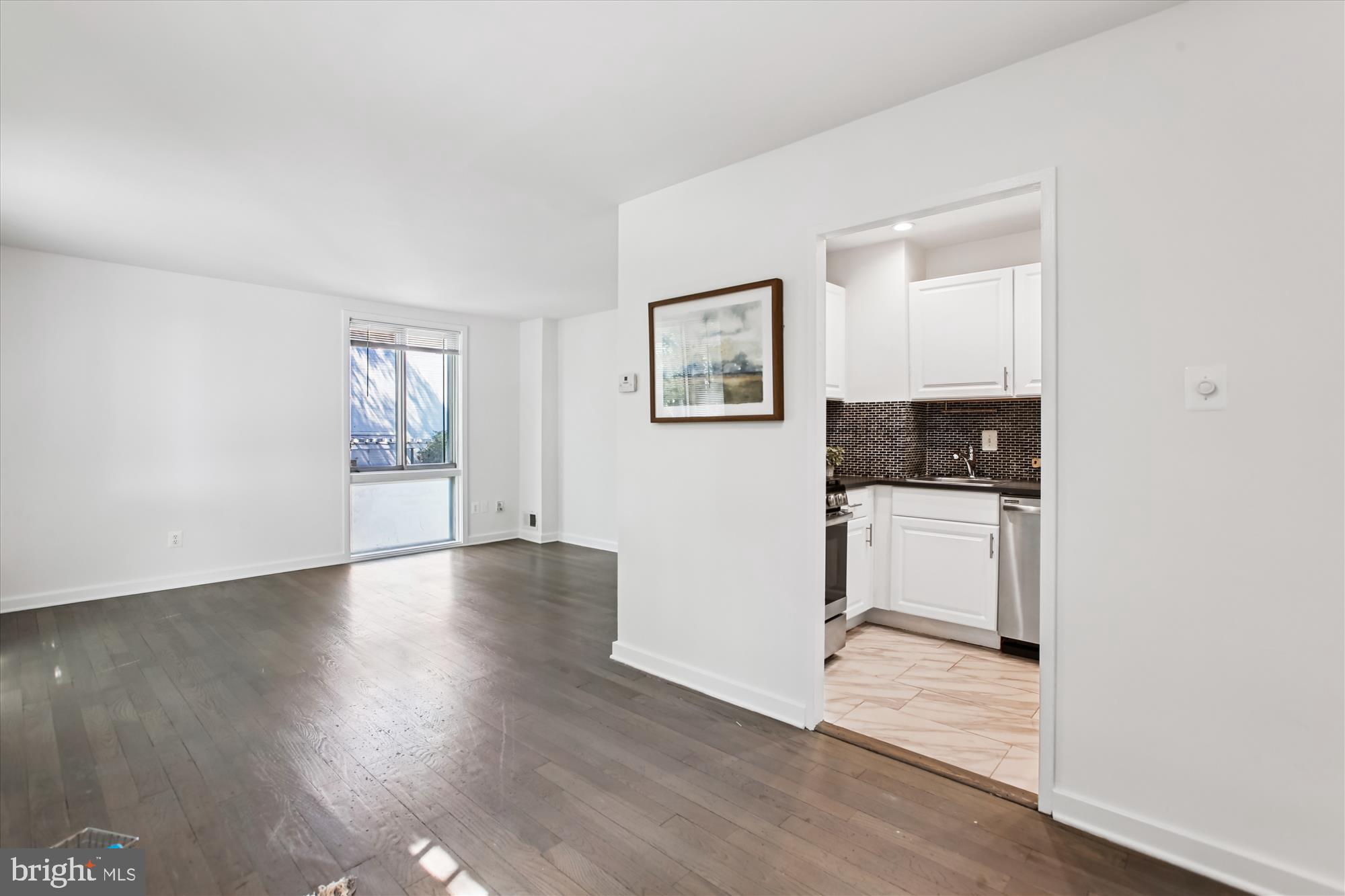 301 I Street Southwest, Unit 108 Washington, DC 20024 - Photo 7 of 55 a view of a livingroom with furniture and wooden floor